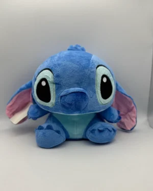 Плюшена играчка Стич в синьо и Ангел в розово, създадени за игри и прегръдки.